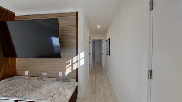 a view of entryway with wooden floor