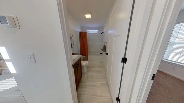 a bathroom with a shower and a tub
