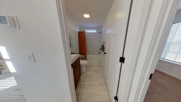 a bathroom with a shower and a tub