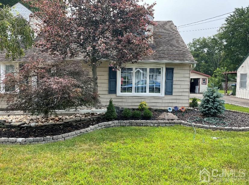91 Ashley Road Edison, NJ 08817 - Photo 3 of 14 a front view of house with a garden and swimming pool