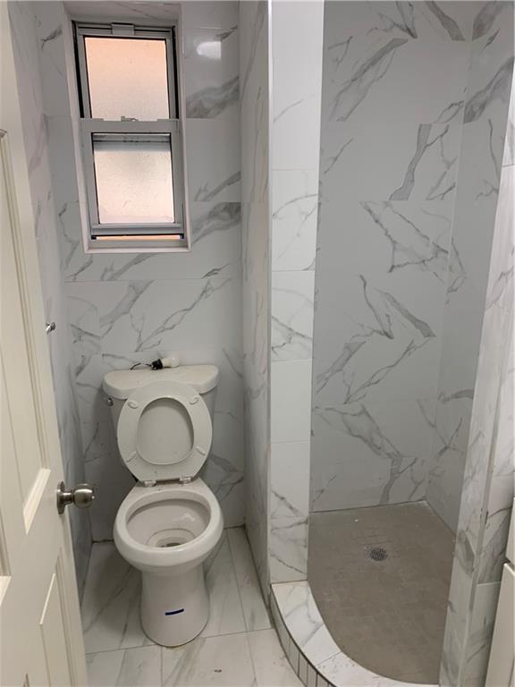 1014 Bay Ridge Parkway Brooklyn, NY 11228 - Photo 7 of 10 a bathroom with a toilet and a shower