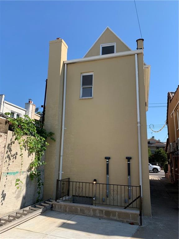 1014 Bay Ridge Parkway Brooklyn, NY 11228 - Photo 8 of 10 a view of a house with a yard