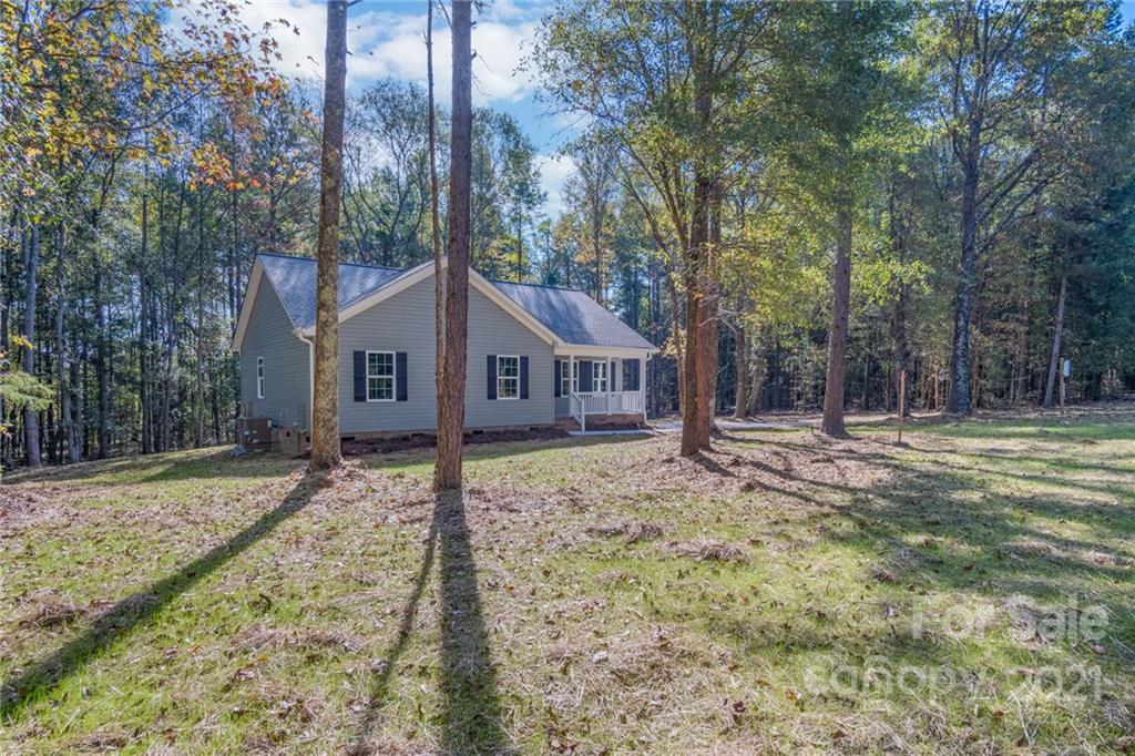 3733 Hamilton Road Edgemoor, SC 29712 - Photo 1 of 29 a dirt road with large trees