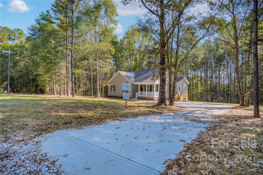 3733 Hamilton Road Edgemoor, SC 29712 - Photo 2 of 29 a front view of a house with a yard and large trees