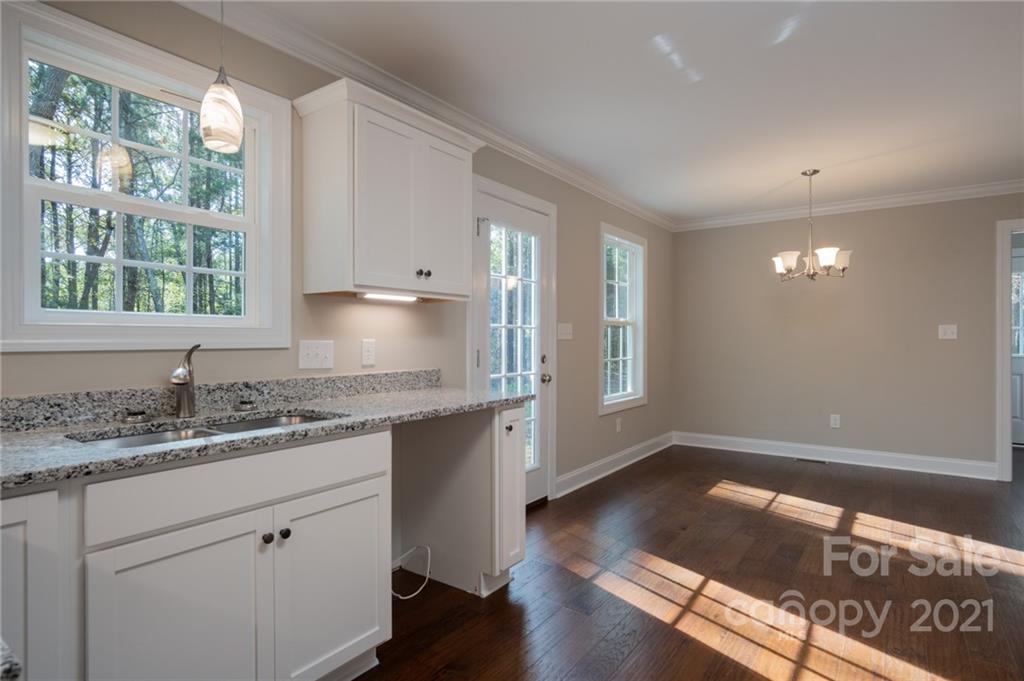 3733 Hamilton Road Edgemoor, SC 29712 - Photo 12 of 29 a kitchen with granite countertop a sink window and cabinets