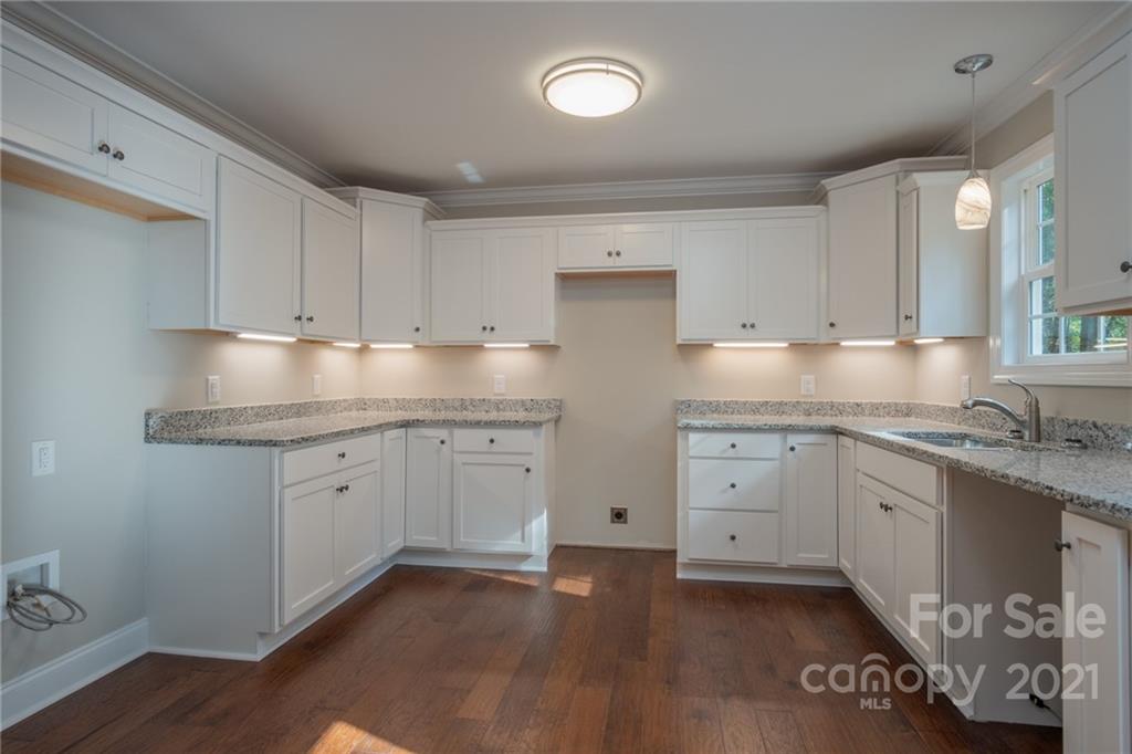 3733 Hamilton Road Edgemoor, SC 29712 - Photo 13 of 29 a kitchen with granite countertop white cabinets and white appliances