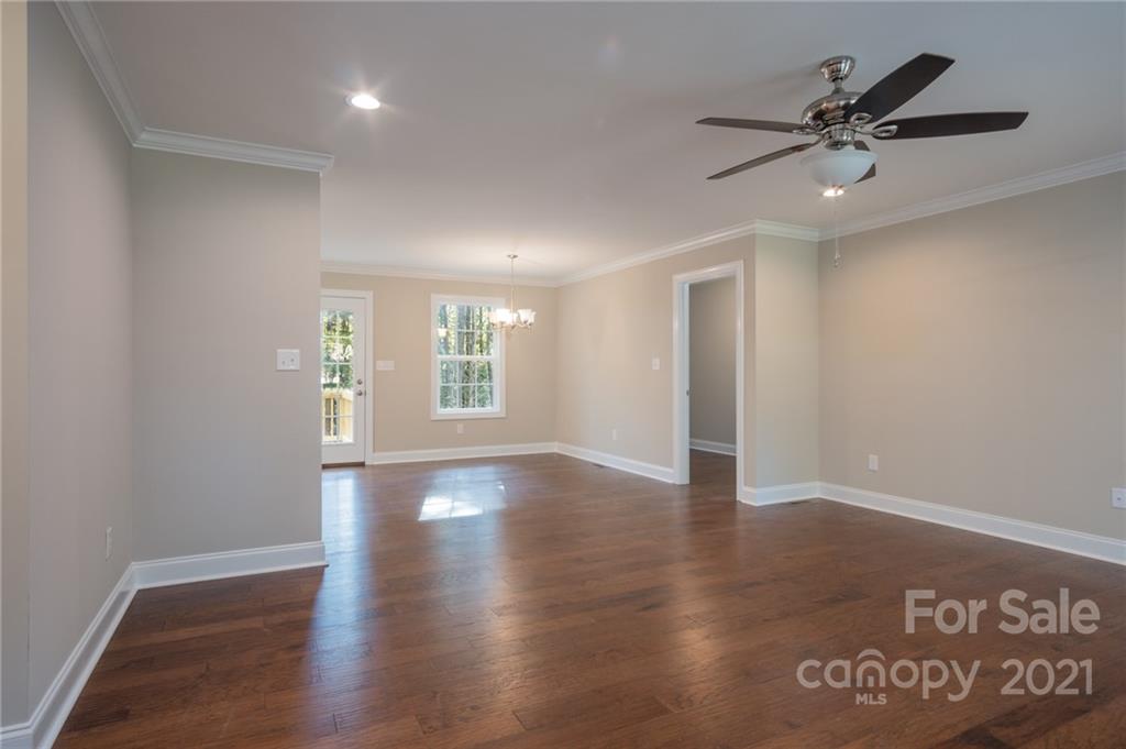 3733 Hamilton Road Edgemoor, SC 29712 - Photo 5 of 29 a view of an empty room with a window and wooden floor