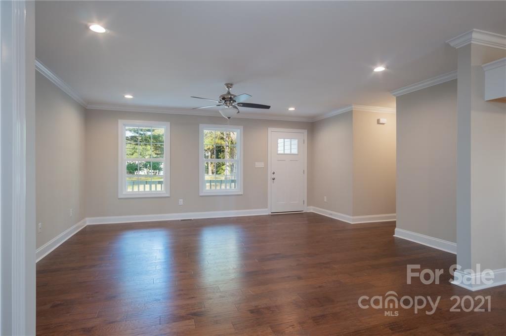 3733 Hamilton Road Edgemoor, SC 29712 - Photo 6 of 29 an empty room with wooden floor and windows