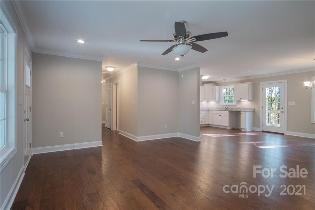 3733 Hamilton Road Edgemoor, SC 29712 - Photo 8 of 29 a view of an empty room with window and wooden floor