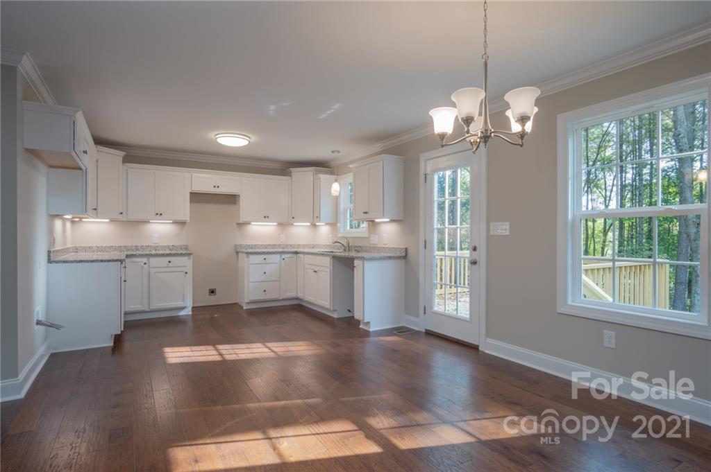 3733 Hamilton Road Edgemoor, SC 29712 - Photo 10 of 29 a view of a kitchen with granite countertop stainless steel appliances and a chandelier