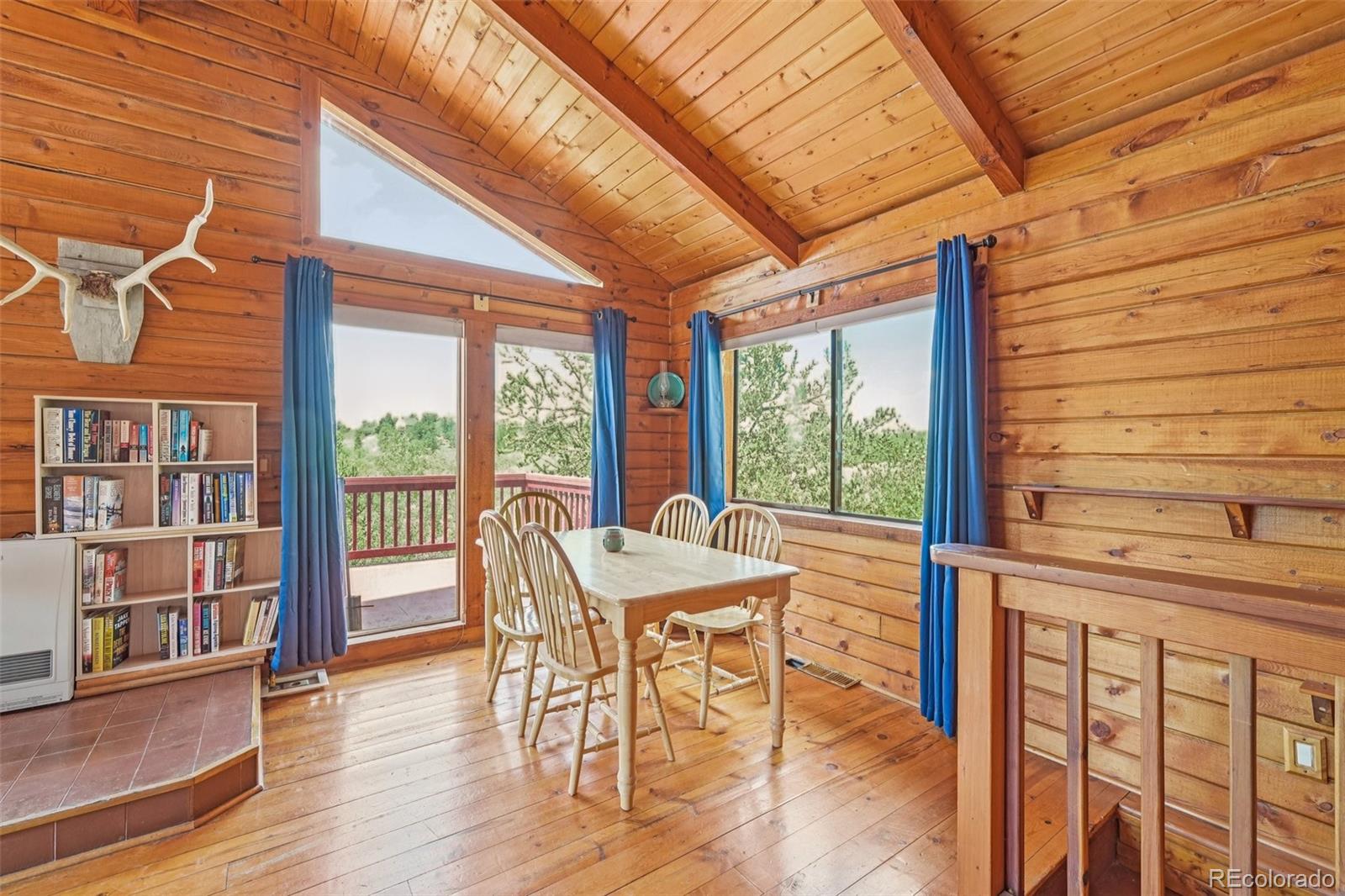 215 Gadwall Road Como, CO 80432 - Photo 12 of 39 a view of a dining room with furniture window and wooden floor