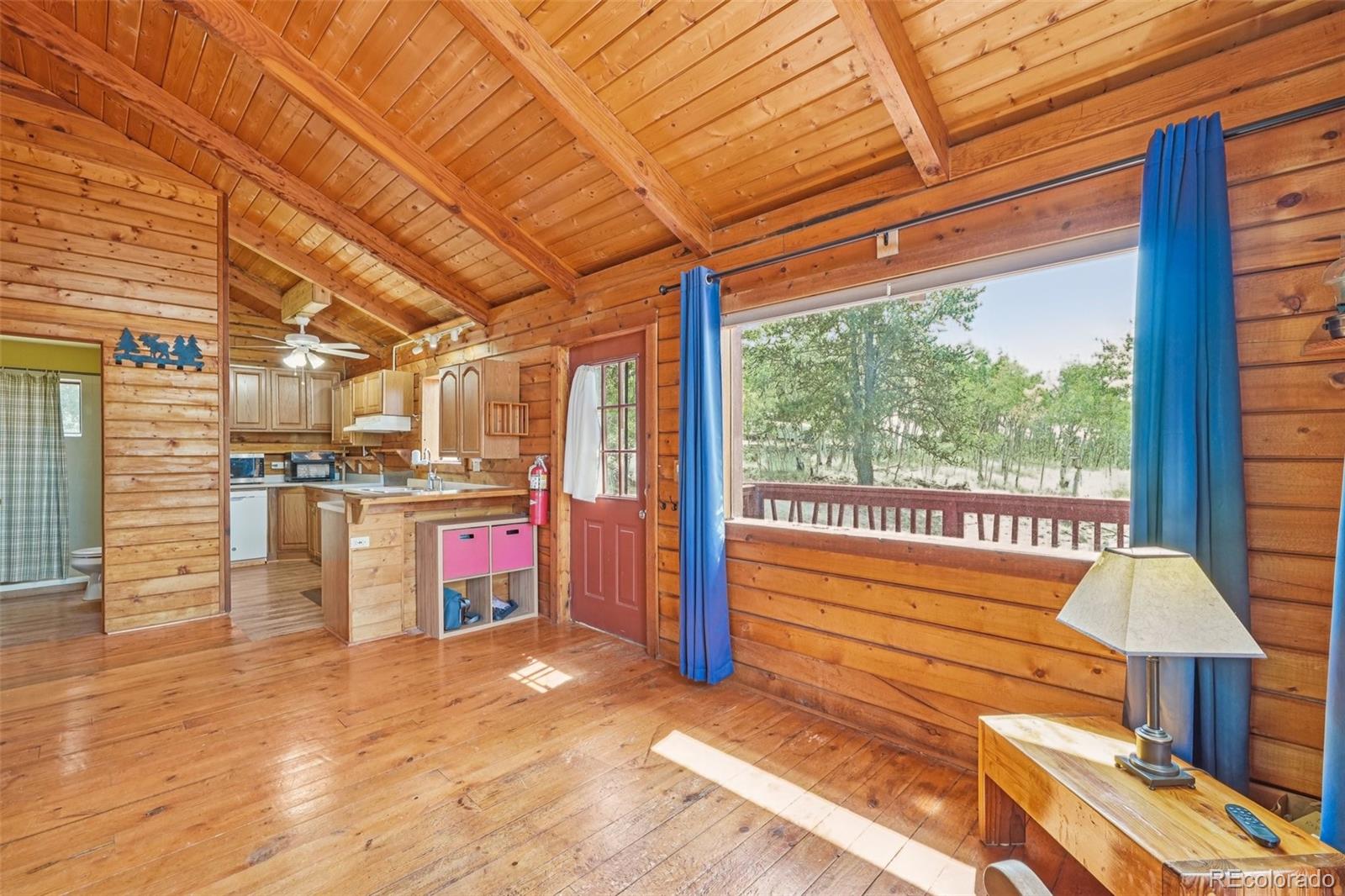215 Gadwall Road Como, CO 80432 - Photo 13 of 39 a view of a porch with furniture and a yard