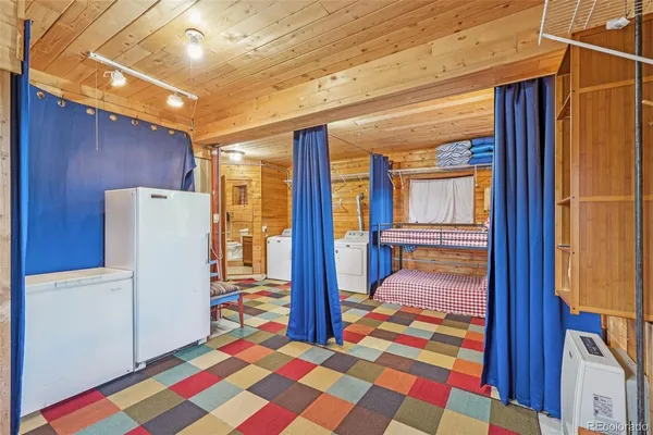a room with a door open to a living room
