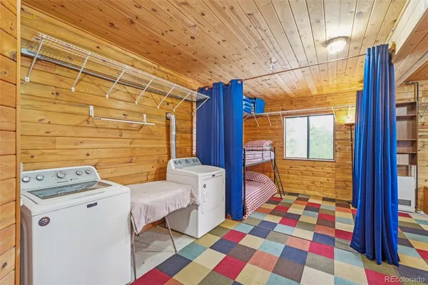 a view of a brick house with a small deck
