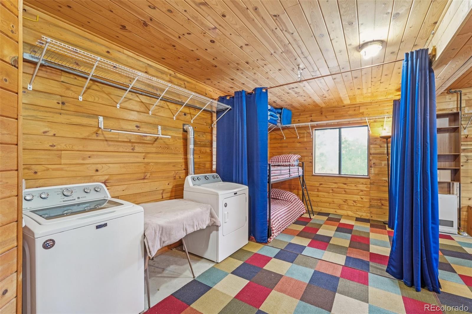 215 Gadwall Road Como, CO 80432 - Photo 21 of 39 a bedroom with a bed and wooden floor