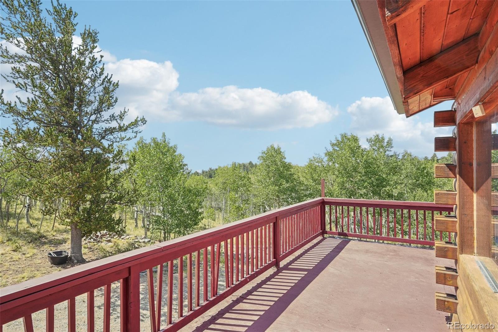 215 Gadwall Road Como, CO 80432 - Photo 28 of 39 a balcony with wooden floor and fence