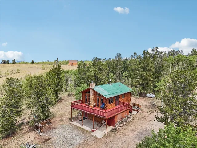 an aerial view of a wooden deck with a trees