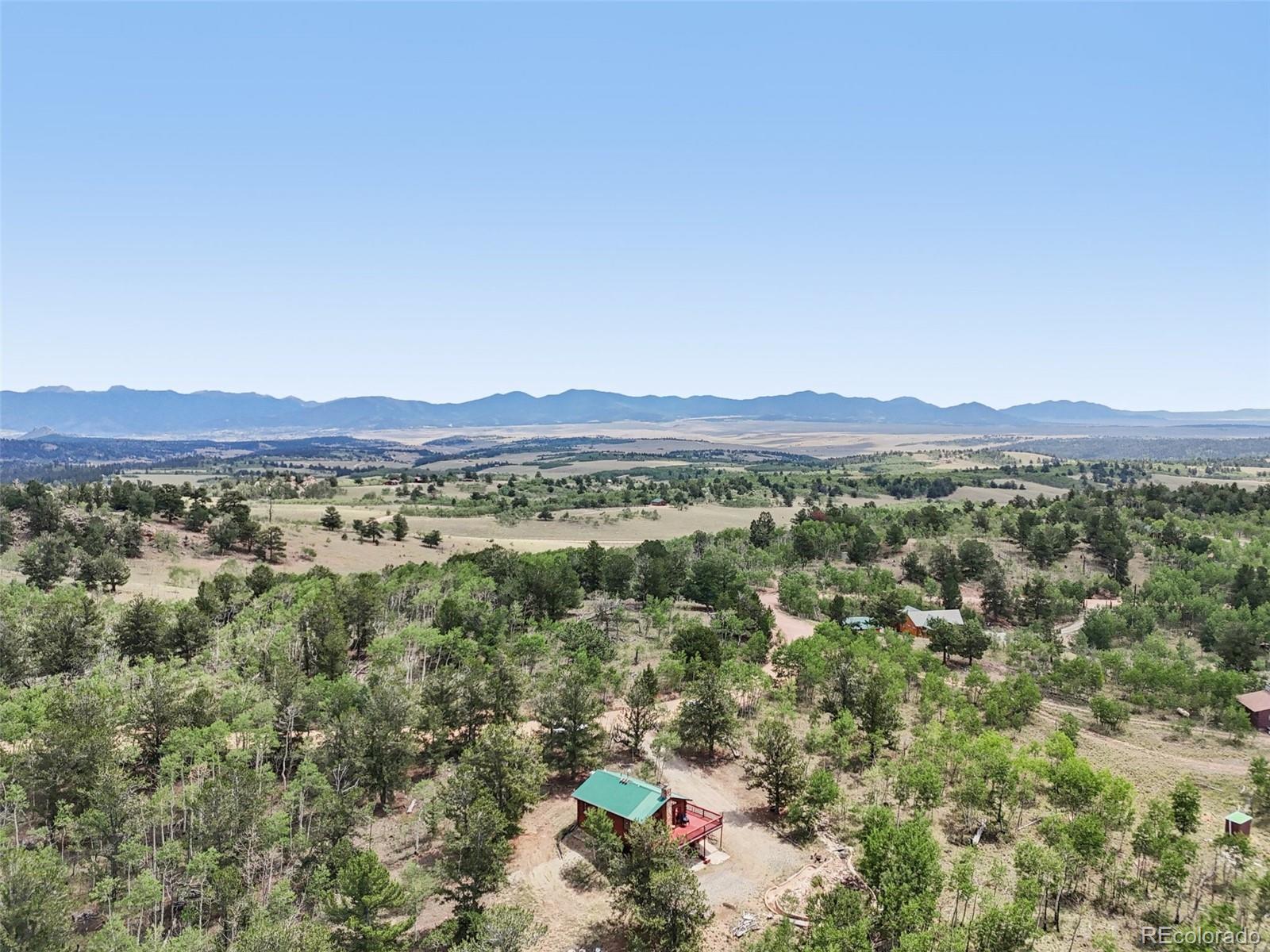 215 Gadwall Road Como, CO 80432 - Photo 36 of 39 a view of a lush green field with lots of bushes