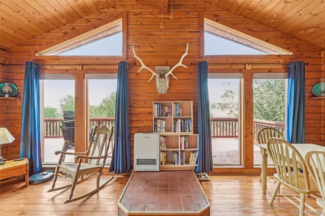 a balcony with furniture and wooden floor