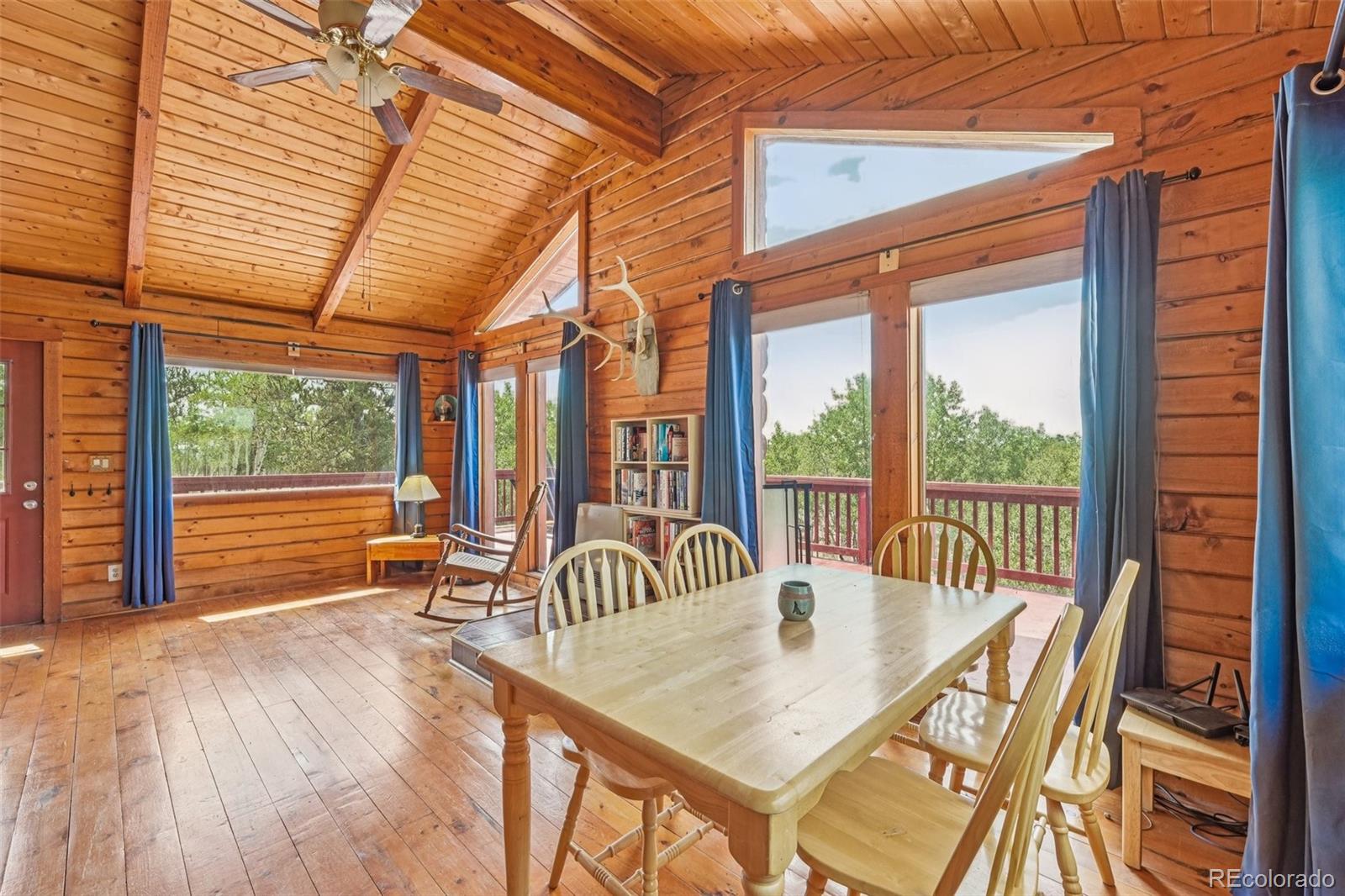 215 Gadwall Road Como, CO 80432 - Photo 10 of 39 a balcony with furniture and wooden floor