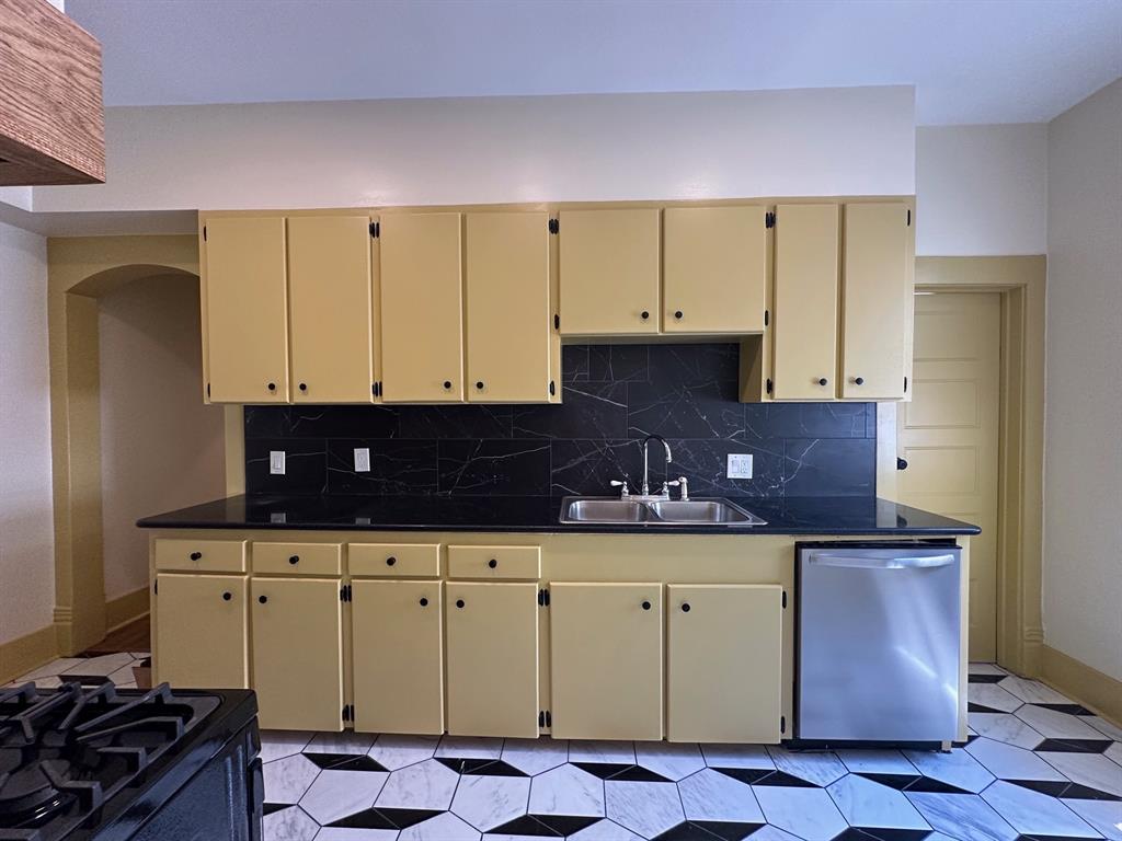 4910 Victor Street, Unit 1 Dallas, TX 75214 - Photo 11 of 30 a kitchen with stainless steel appliances a cabinets and a counter space