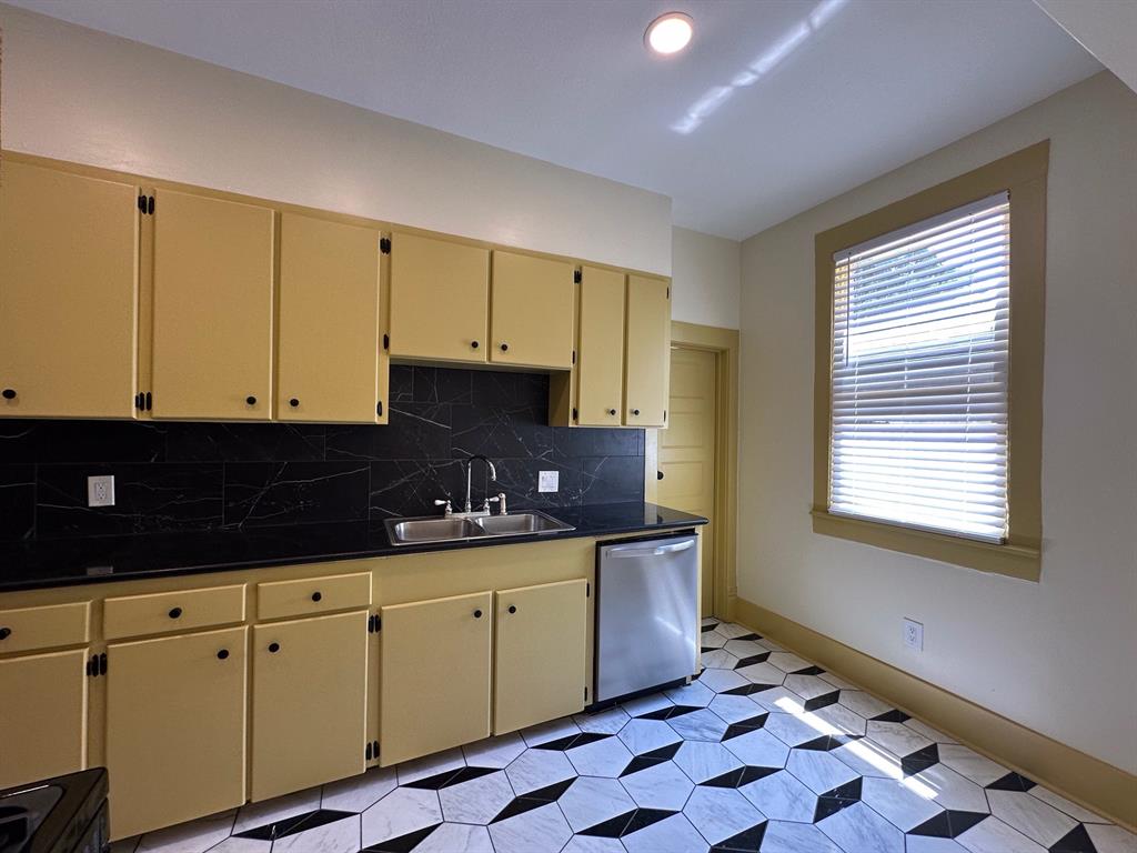 4910 Victor Street, Unit 1 Dallas, TX 75214 - Photo 14 of 30 a kitchen with granite countertop a sink and cabinets