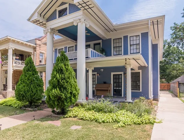 front view of the house with a yard