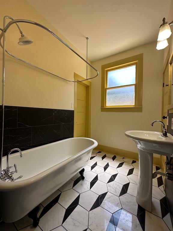 4910 Victor Street, Unit 1 Dallas, TX 75214 - Photo 23 of 30 a bathroom with a sink and a mirror