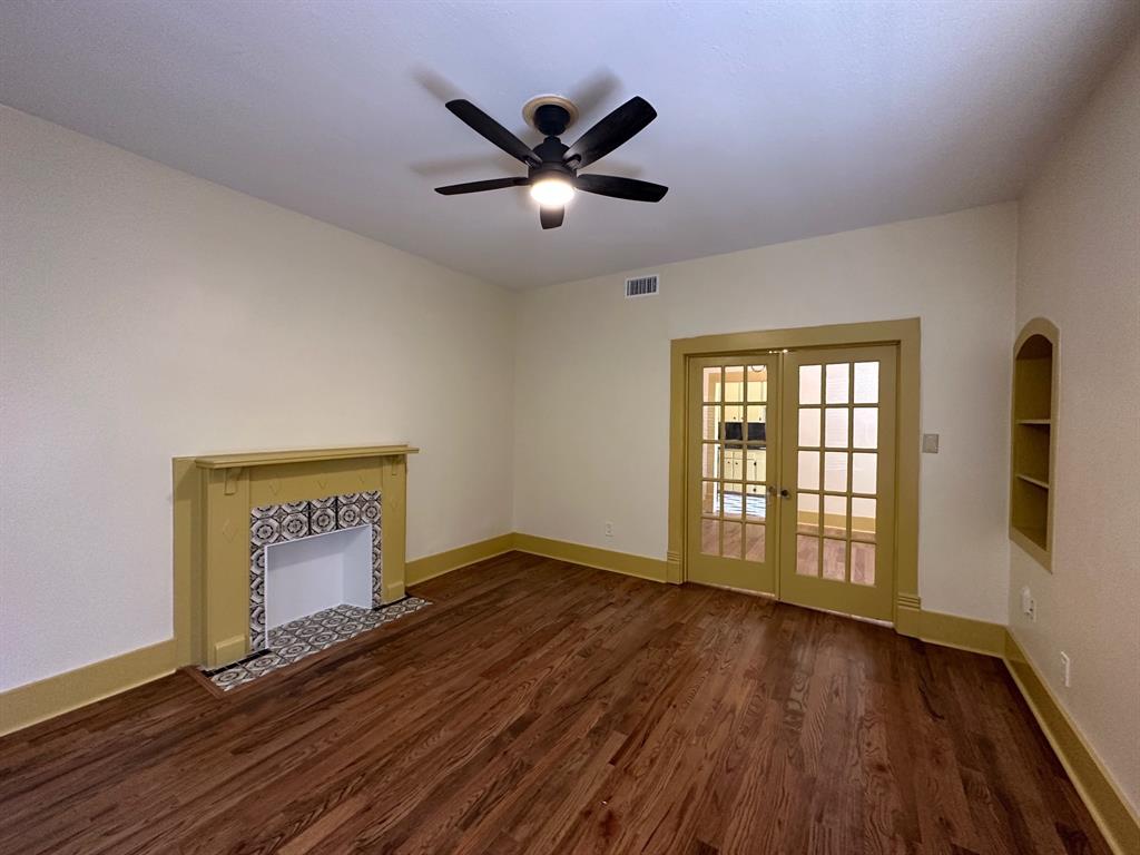 4910 Victor Street, Unit 1 Dallas, TX 75214 - Photo 4 of 30 wooden floor in an empty room with a window