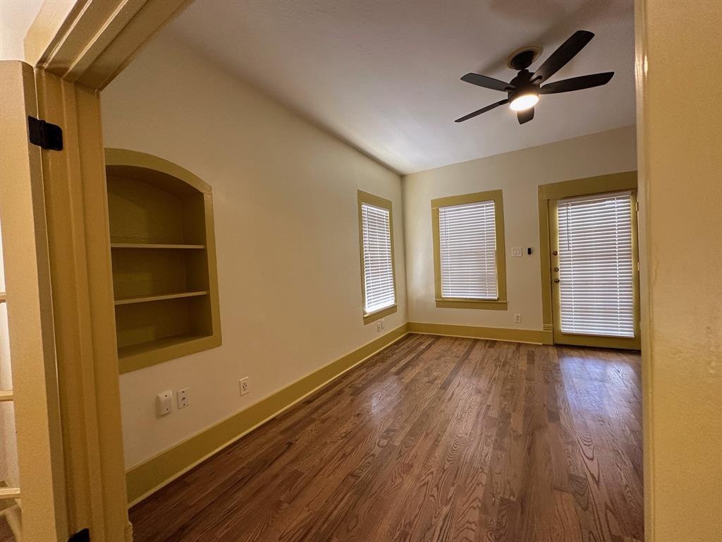 4910 Victor Street, Unit 1 Dallas, TX 75214 - Photo 5 of 30 wooden floor in an empty room with a window