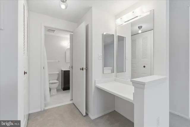 a bathroom with a double vanity sink mirror and shower