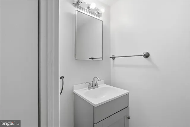 a bathroom with a sink and mirror