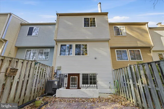 a view of a house with wooden deck