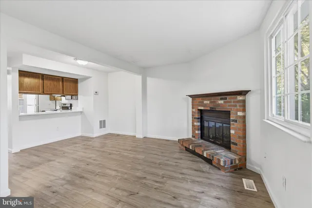 a bedroom with a bed and a fireplace