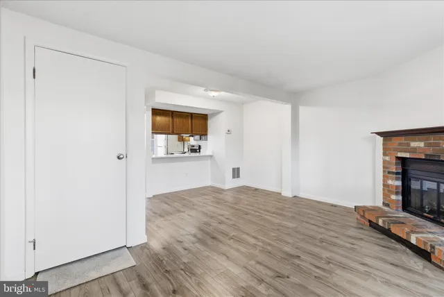 a bedroom with a bed and a fireplace