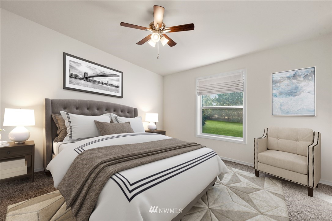 18512 Elderberry Street Southwest Rochester, WA 98579 - Photo 10 of 18 a bed room with a bed and a couch