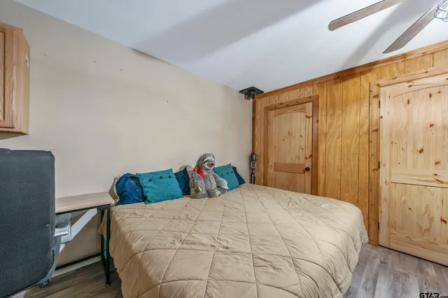 a bedroom with a bed and a closet