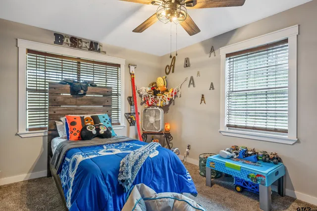 a bedroom with bed and a window