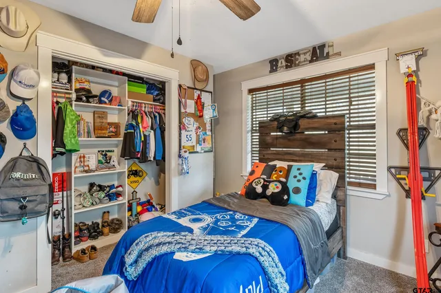 a bedroom with bed and a window