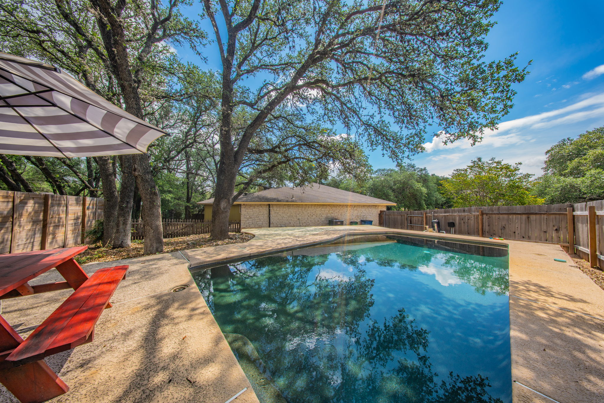 4504 Langtry Lane Austin, TX 78749 - Photo 2 of 24 An inviting backyard oasis offers a sparkling pool for ultimate relaxation.