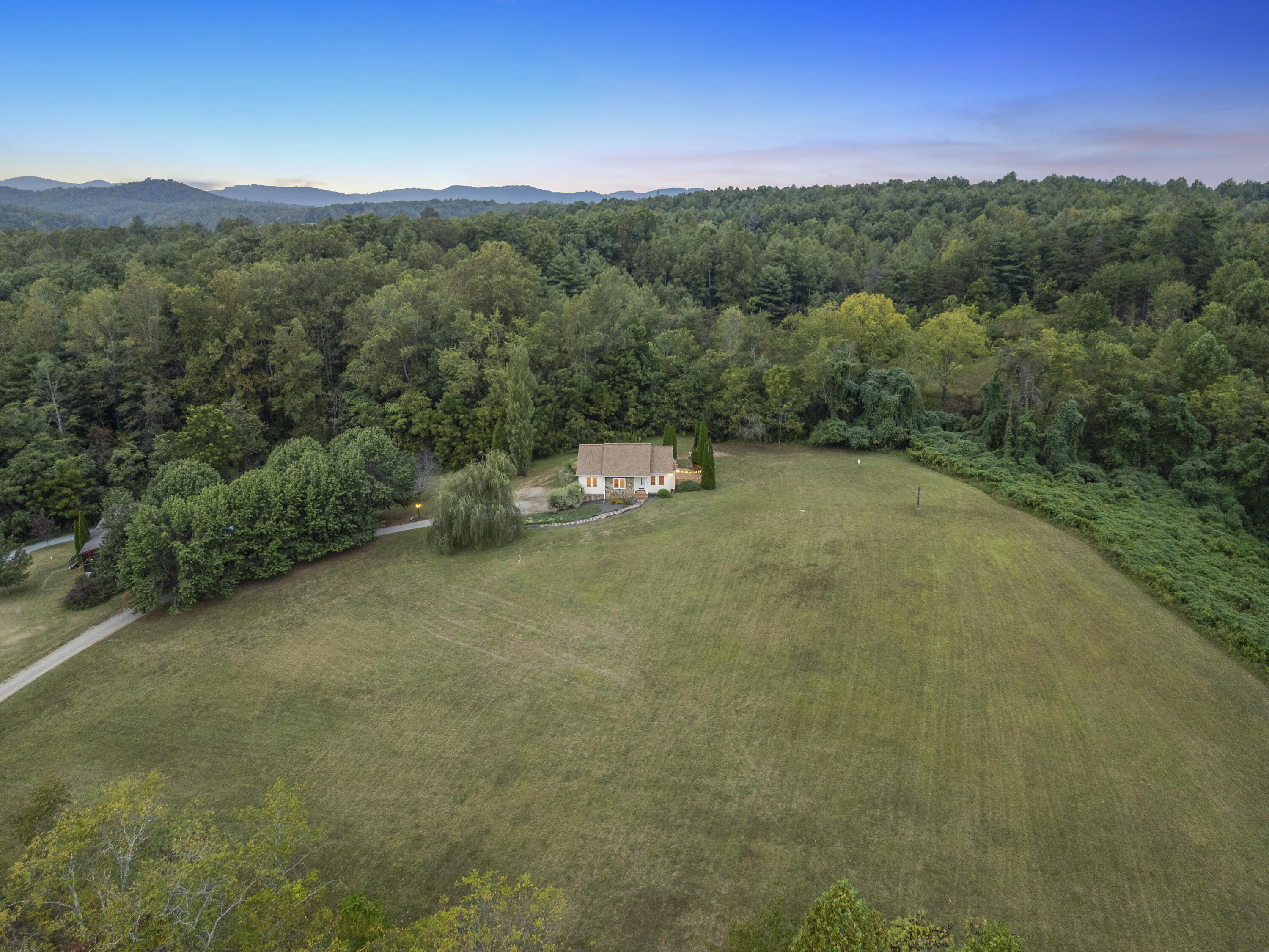 885 Whetstone Road Ferrum, VA 24088 - Photo 54 of 64 a view of a field with mountains in the background