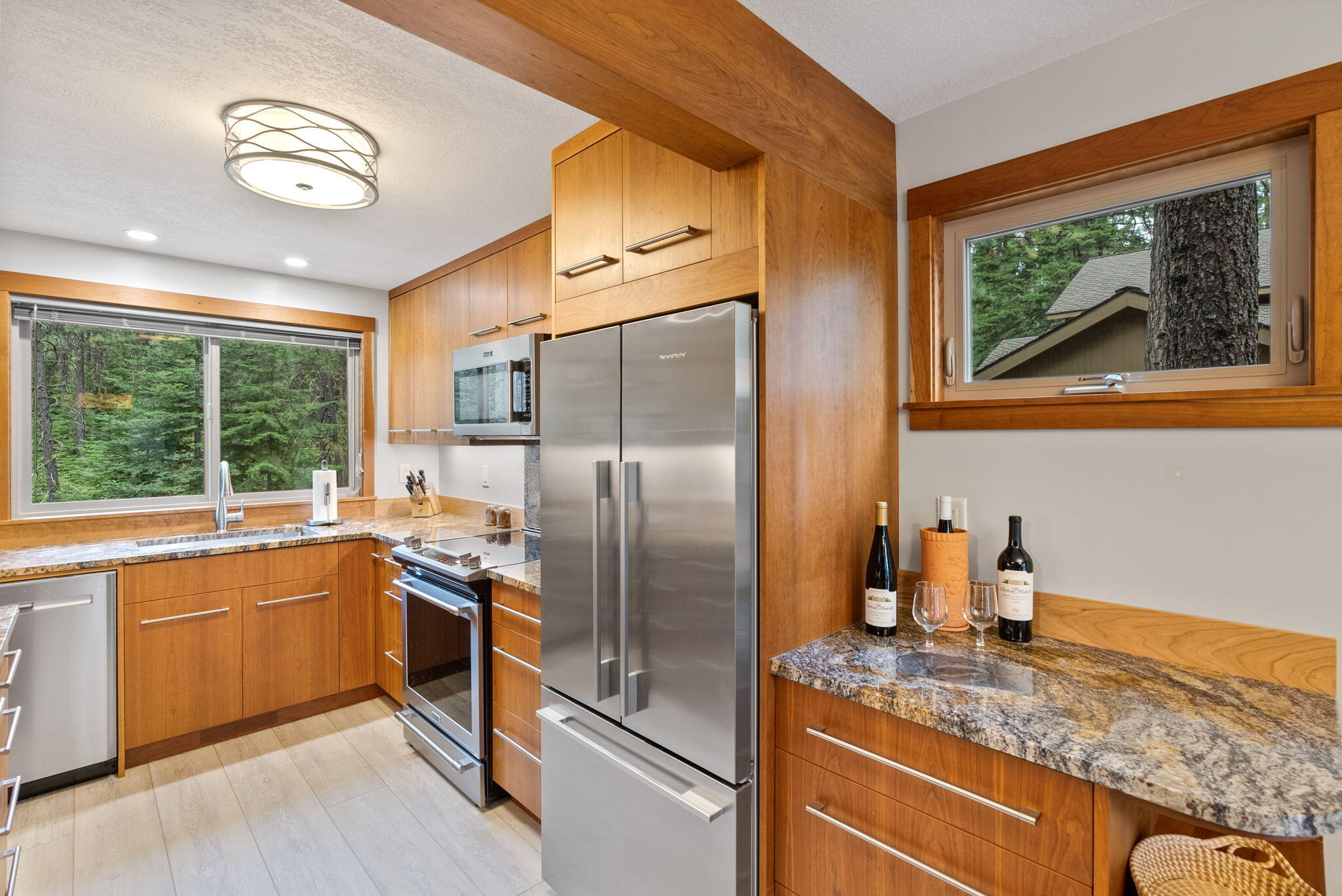 13251 Snowbrush, Unit GH 266 Black Butte Ranch, OR 97759 - Photo 2 of 37 a kitchen with stainless steel appliances granite countertop a refrigerator a stove and a sink
