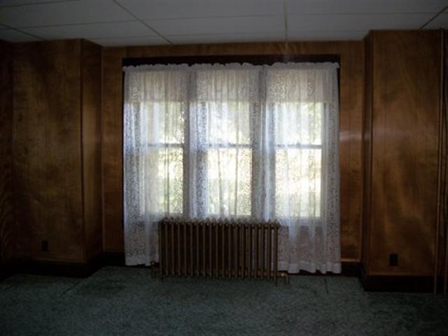 8729 South Massbach Road Elizabeth, IL 61028 - Photo 4 of 12 an empty room with windows