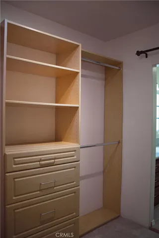 a view of storage and utility room with washer and dryer