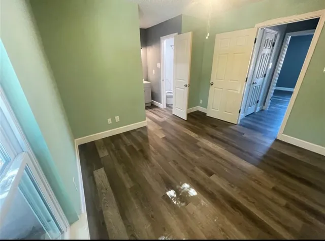 a view of entryway with wooden floor