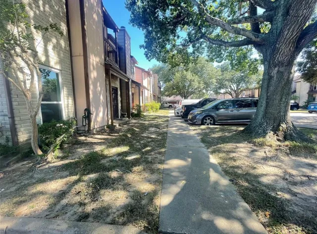 a view of a street with cars