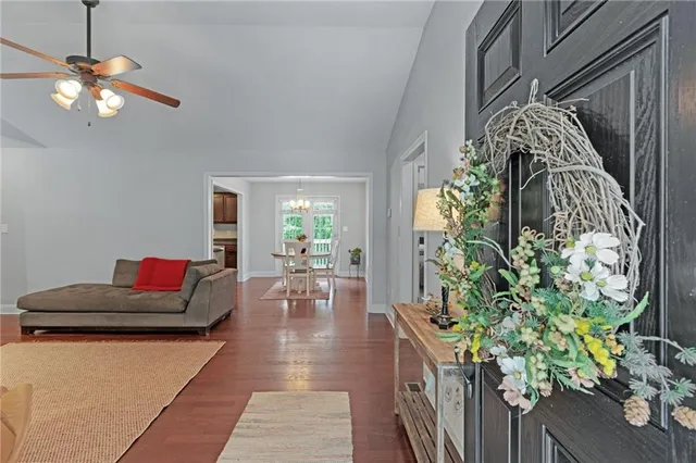 a bedroom with furniture and a chandelier