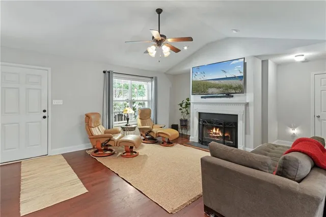 a living room with furniture or couch and a fireplace