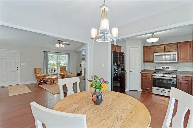 a kitchen with a sink stove top oven and microwave
