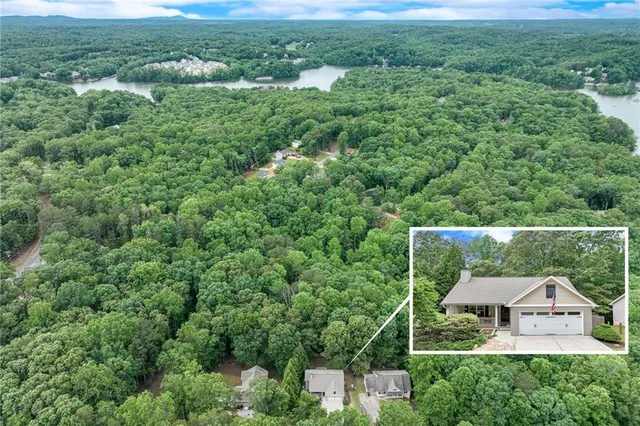 a view of a house with a yard and lake